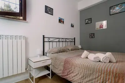 a bedroom with a bed with pillows on it at La casa dell’attore - Roma Pigneto in Rome