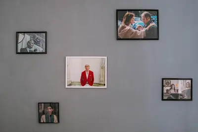 a wall with pictures of people on it at La casa dell’attore - Roma Pigneto in Rome