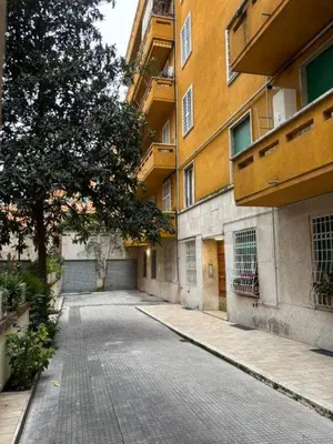 an empty street in front of a building at Profumo di Sorrento a Roma in Rome