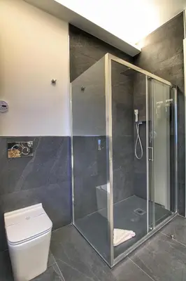 a shower stall in a bathroom with a toilet at Roma Centro CDR Luxury Suites in Rome
