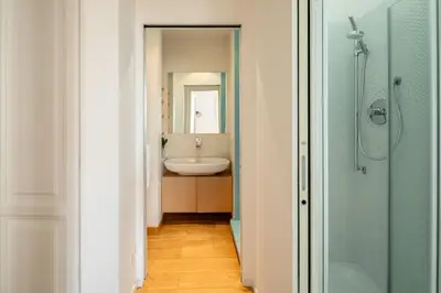 a bathroom with a sink and a mirror at Via G. Ferrari Private Apartment in Rome