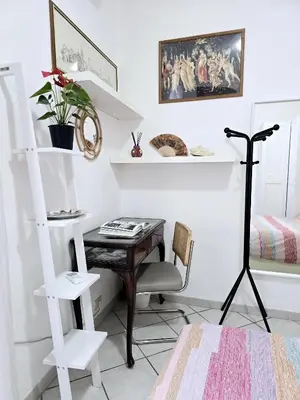 a room with a desk and a chair and a shelf at Oasi San Pietro in Rome