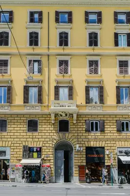 a yellow building with a door in front of it at 163 BOUTIQUE HOTEL in Rome