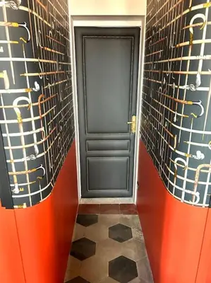a black door in a room with a tile floor at The Grand Tour Bed & Breakfast in Rome