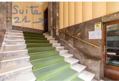 a staircase with green steps in front of a building at Suite21-Parioli in Rome