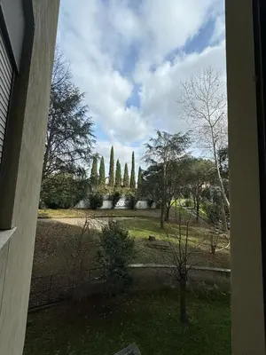 a view of a park with trees and a fence at RAHIMA GUEST HOUSE in Rome
