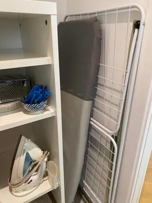 a closet with a refrigerator with white shelving at Camilluccia Dream Apartment in Rome