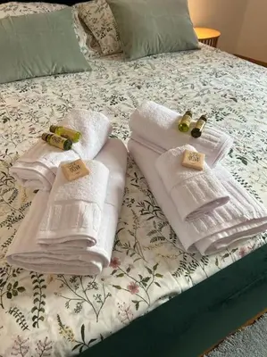 two towels on a bed with price tags on them at Trastevere Monteverde Velia House in Rome