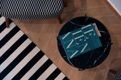an overhead view of a table with a book on it at Victorian House, Rome Center in Rome