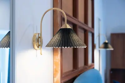 a lamp hanging on the side of a door at Victorian House, Rome Center in Rome