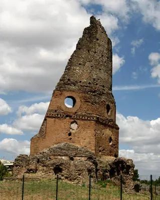an old brick tower with a hole in the top at Corona House in Rome