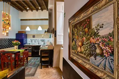 a large painting of fruit on the wall of a restaurant at Rome as you feel - Vicolo delle Grotte in Rome