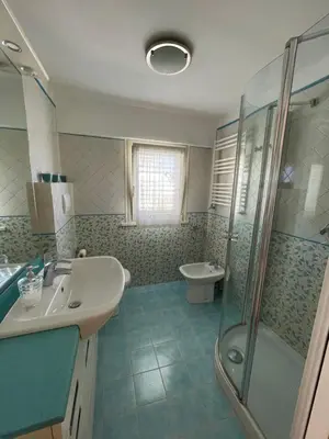 a bathroom with a sink and a shower at Trastevere Lenci House in Rome