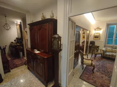 a room with a large wooden cabinet and a living room at Gay House Roma - Only Gay in Rome