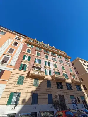 a tall building with balconies on the side of it at Gay House Roma - Only Gay in Rome
