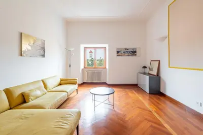 a living room with a couch and a table at AppleMoon2.0 in Rome