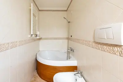 a bathroom with a tub and a toilet and a sink at AppleMoon2.0 in Rome