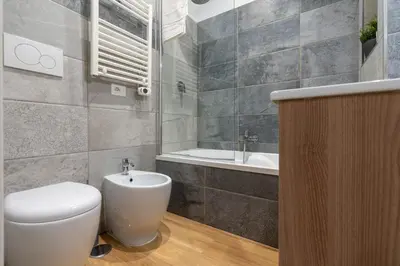 a bathroom with a toilet and a sink at PL Guest House in Rome
