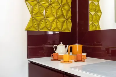 a kitchen counter with orange and white appliances on it at Via Veneto Supreme Terrace in Rome