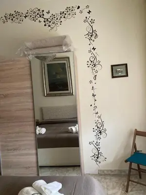 a bedroom with a mirror and a bed at Le Mille e Una Notte in Rome