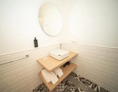 a bathroom with a sink and a mirror at Youroom Margutta in Rome