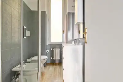 a small bathroom with a toilet and a sink at Giove in Trevi in Rome