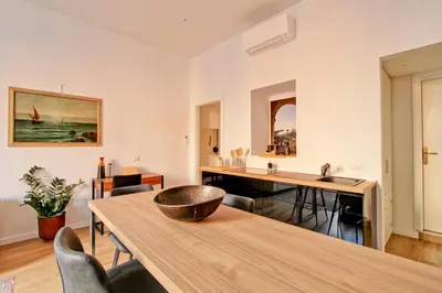 a kitchen with a table and chairs and a sink at Giove in Trevi in Rome