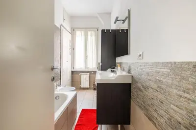 a bathroom with a sink and a bath tub and a tub at Comfortable apartment Via Appia - B in Rome