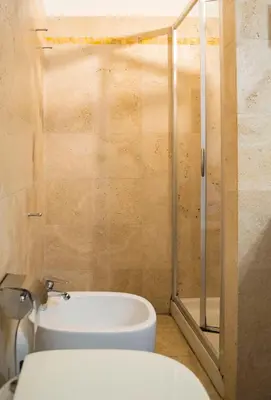 a bathroom with a toilet and a shower at Campo De Fiori- Deluxe&Relax in Rome