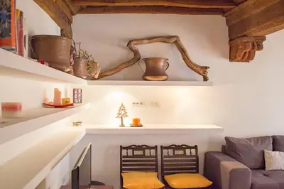 a living room with a couch and a chair at Campo De Fiori- Deluxe&Relax in Rome
