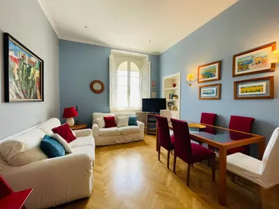 a living room with a table and chairs at Lilla’s Apartment in Rome