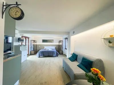 a living room with a couch and a bed at San Peter View in Rome