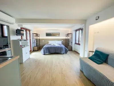 a bedroom with a bed and a couch at San Peter View in Rome