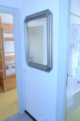 a mirror on the wall of a bathroom at Appartamento 