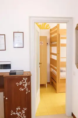 a room with a door leading to a bedroom at Appartamento 