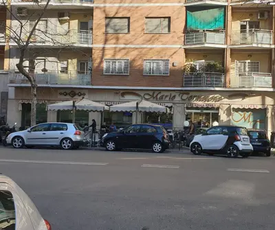 a group of cars parked in front of a building at Appartamento 