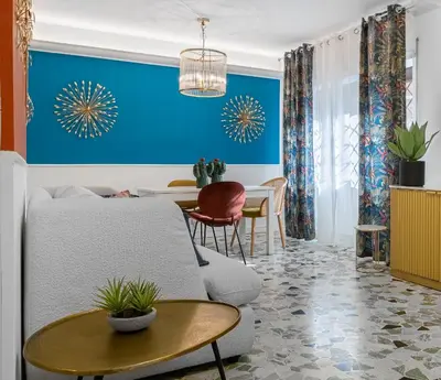a living room with a couch and a table at Flaminio Charme Apartment in Rome