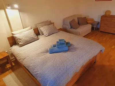 a bedroom with a bed with a blue item on it at Appartamento 