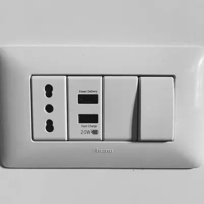 an electrical outlet with four switches on it at Lucy's Roof in Rome