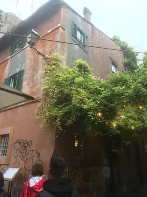 a group of people standing in front of a building at Anna’s home in Rome