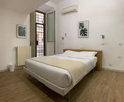 a bedroom with a large bed in a room at Flat Between The Vatican and Piazza del Popolo in Rome