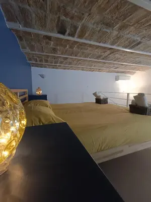 a bathroom with a glass shower and a toilet at Trastevere in Loft Roma in Rome