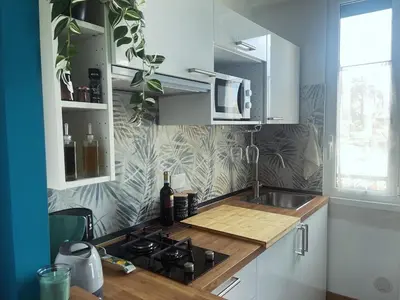 a kitchen with a sink and a stove top oven at Casetta Tuscolana in Rome