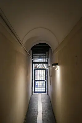 an empty hallway with a window in a building at Trastevere Characteristic Roman Home in Rome