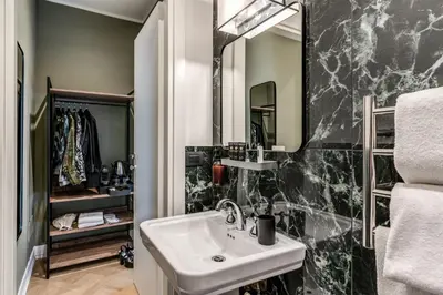 a bathroom with a sink and a mirror at Dimore Paganica in Rome