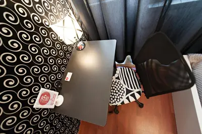 a room with a black and white patterned wall at Take It Easy Roma Guest House in Rome