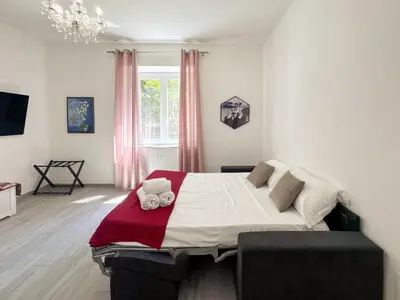 a bedroom with a large bed in a room at Appartamento per 4 persone a Garbatella - My Garba in Rome