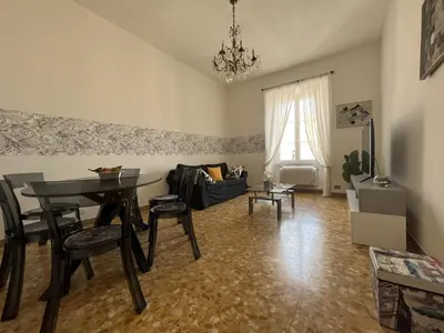 a living room with a table and a couch at interno 18 penthouse in Rome