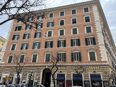 a large brick building on a city street at interno 18 penthouse in Rome