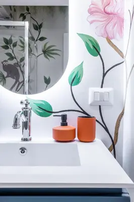 a bathroom with a sink and a mirror at Leonina Apt - Colosseum in Rome